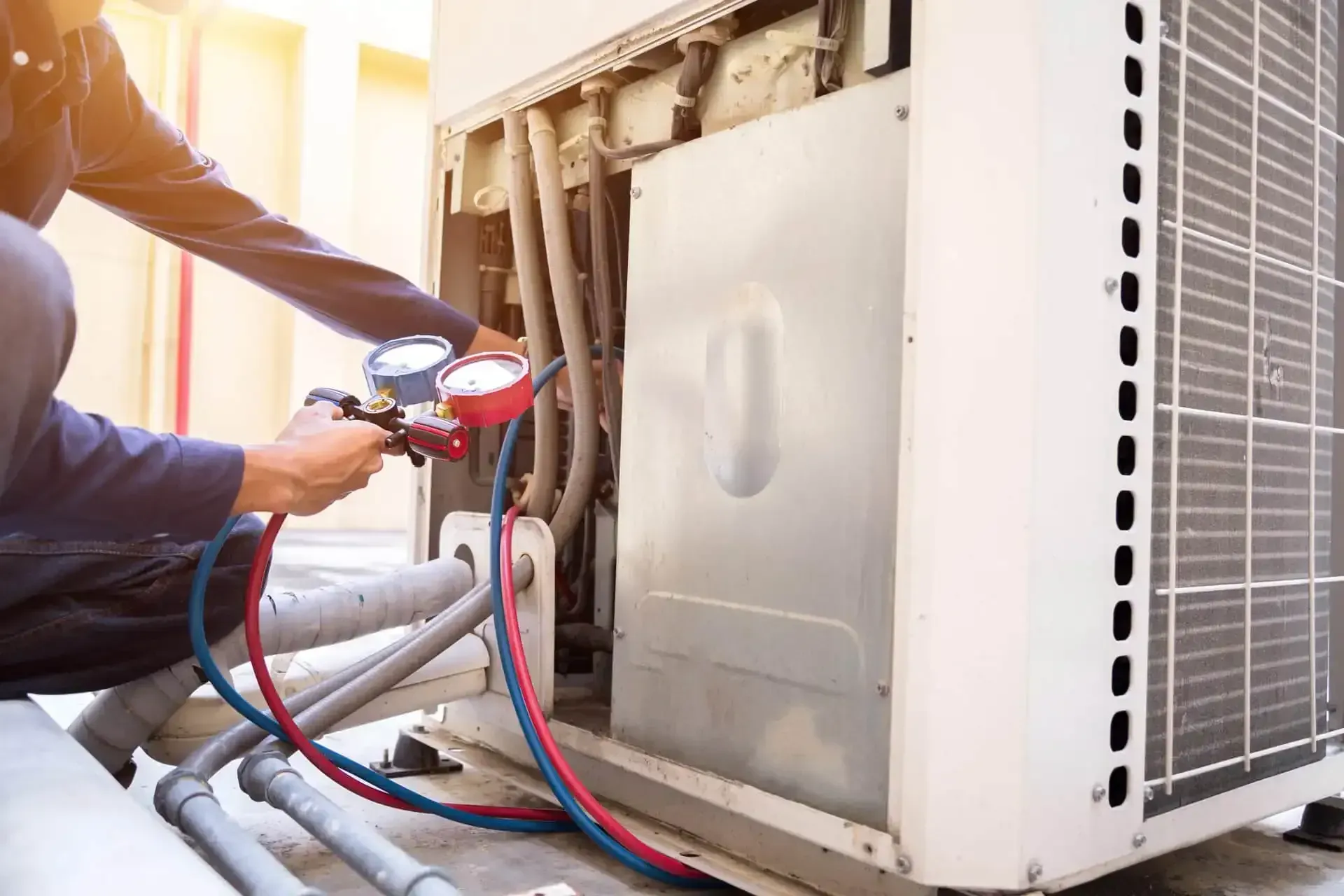 Rooftop commercial air conditioning units in bright sunlight.